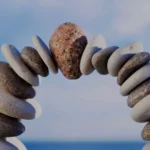 Photo of a stacked arch of stones on a beach